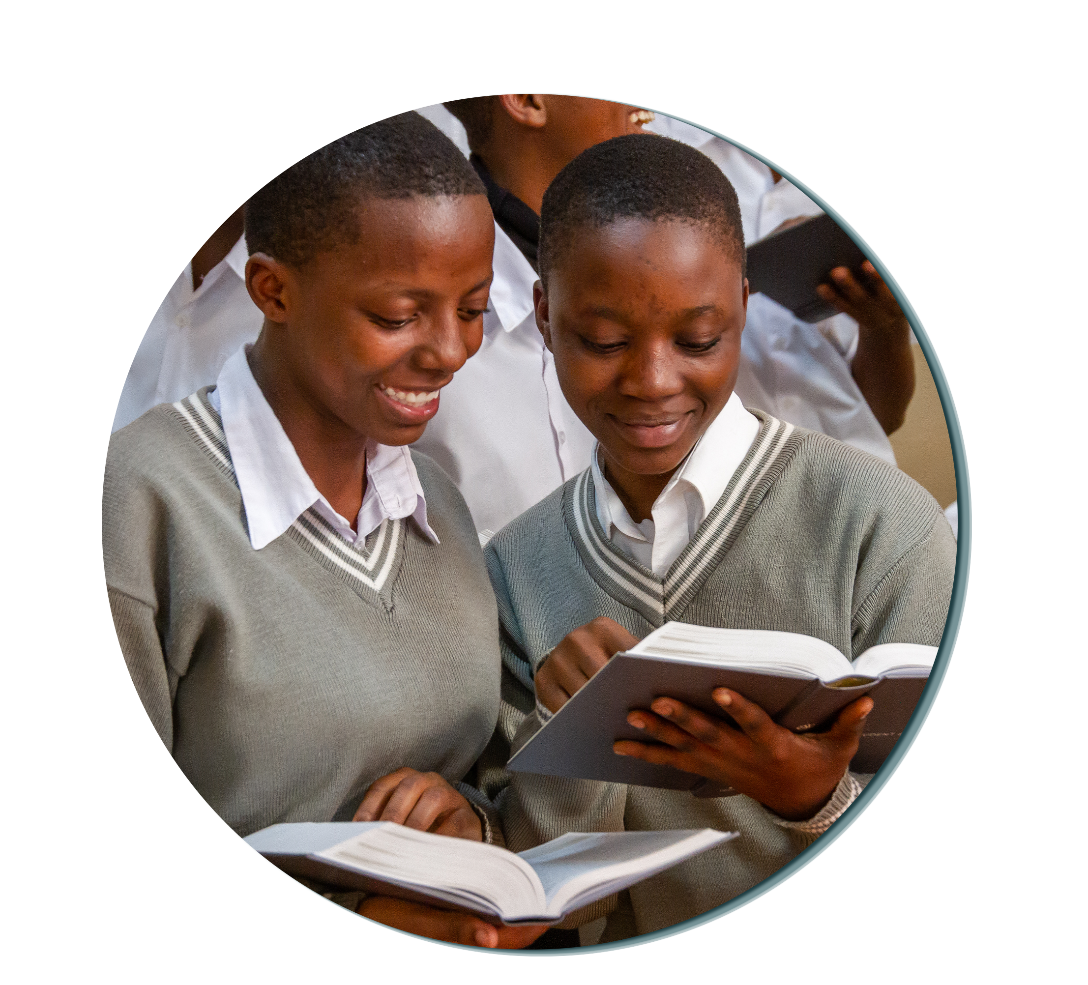 Two girls looking over bibles